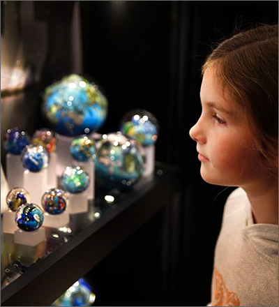Young visitor admires Simpson Planets