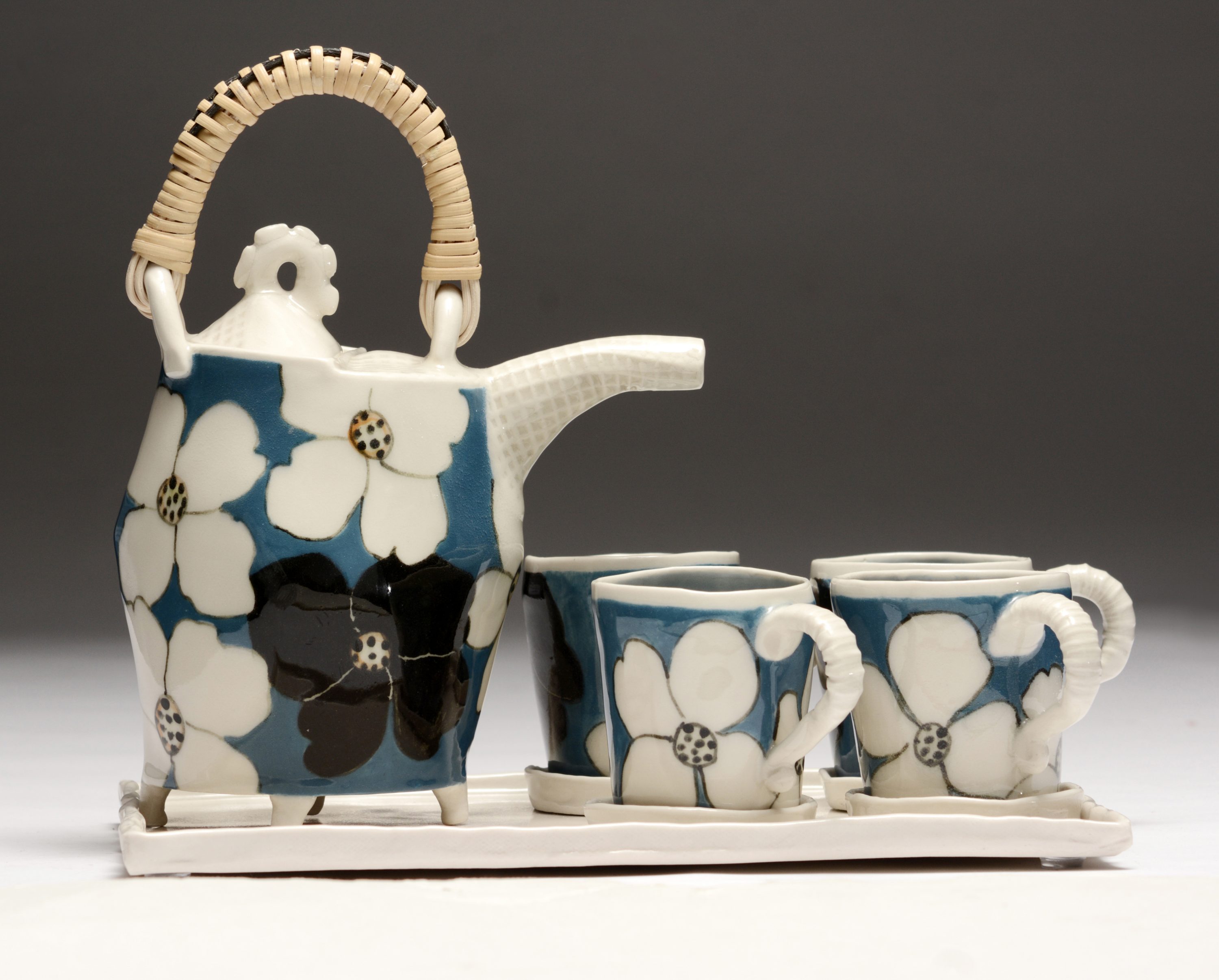 Form, texture, pattern, and luminosity are the hallmarks of artist Jerry Bennett’s ceramics. Tea set, glazed high fired porcelain.