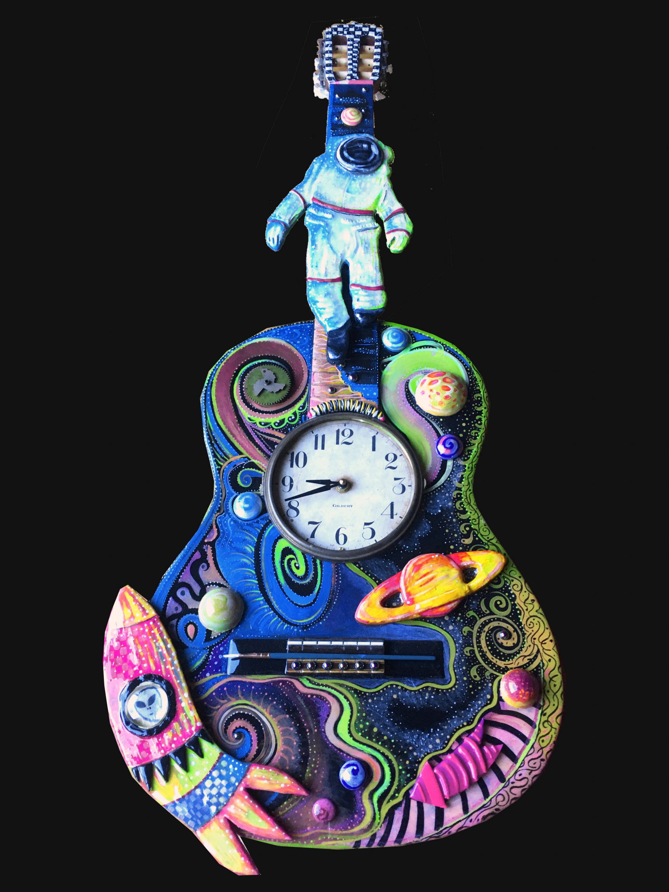 Linda Jacque has carved out a niche for herself at Paradise City, with eager collectors of her colorful work lining up the very first day of the show. Each handpainted piece of art, furniture, timepieces and even musical instruments are one-of-a-kind. "Space Guitar", carved and painted wood guitar with found objects and clock mechanism.