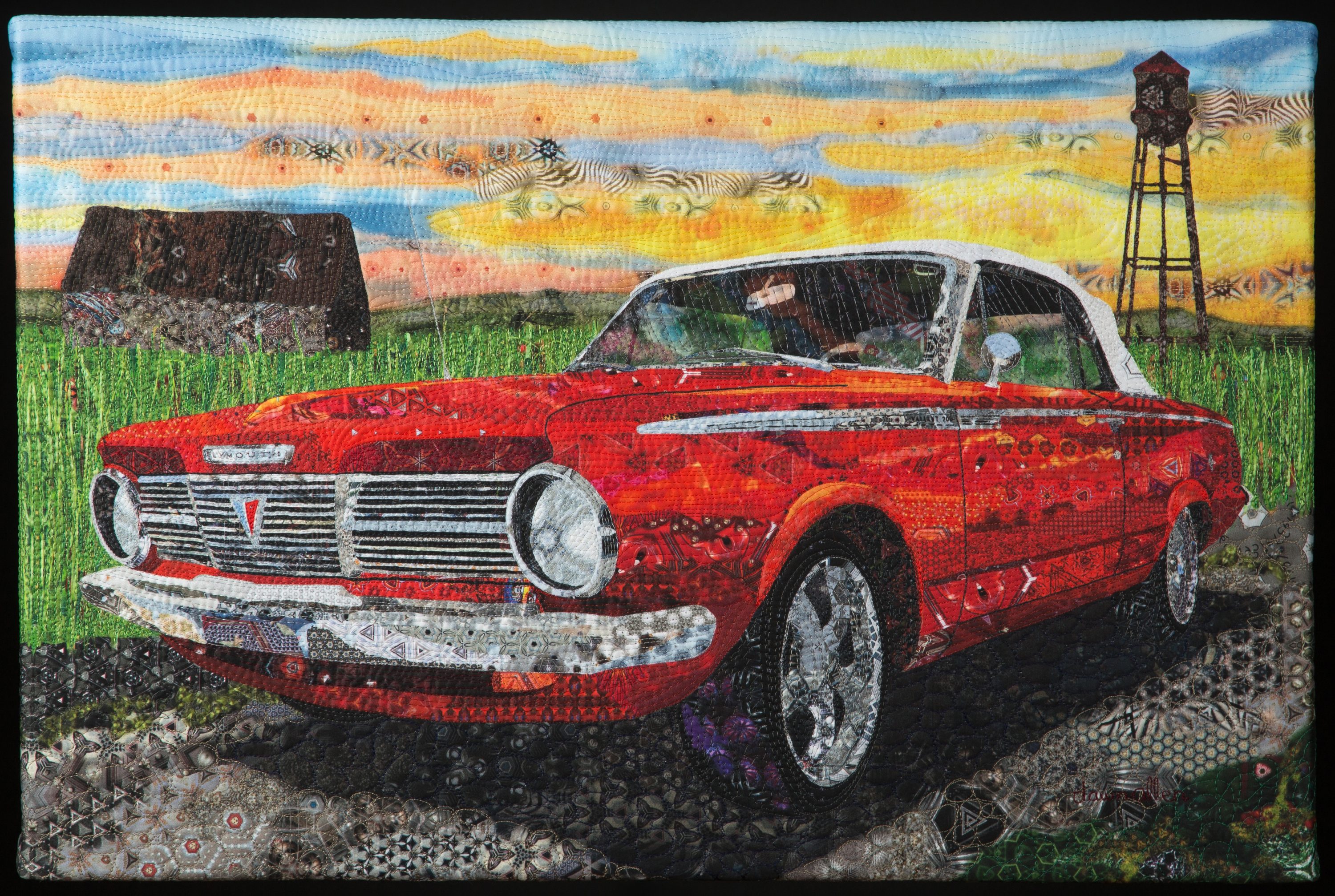 Dawn Allen defines her art medium as digital art fiber, for which she has invented her own technique. She starts with photos she has taken, using her computer to transform the image into repeating patterns of bright color. She then wields her computer stylus pen to freehand draw a new image. Once she is satisfied with her digital painting, Allen typically prints the image on fabric and finishes the piece in the style of a quilt with three layers of batting, backing and stitching. The result is richly textured artwork full of color and life that reminds viewers of the good times in their lives. "Corn Field": cotton fabric printed with original digital image and quilted. 30" x 50". Photo by Jeff Blanchine.