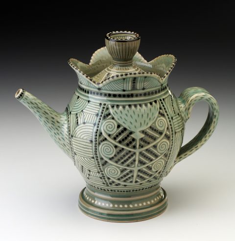 James Guggina's hand thrown stoneware teapot featuring sgraffito and slip trailing with a celadon glaze.